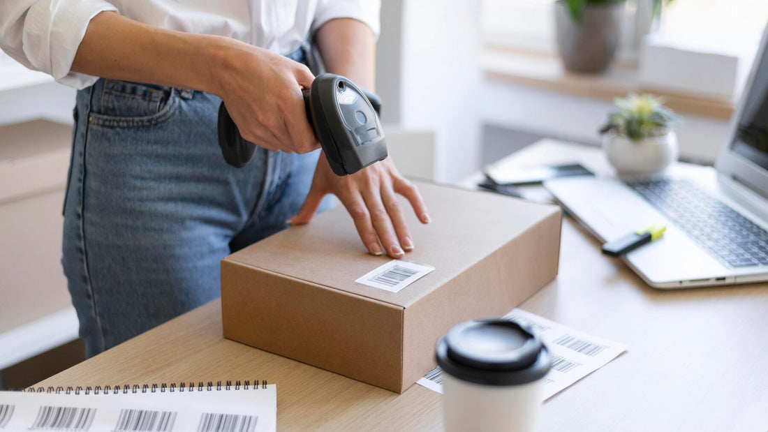 a lady scanning a barcode in a box with a barcode scanner