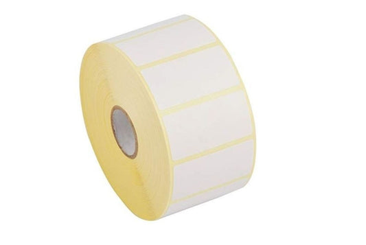 A roll of white thermal labels on a yellow backing, designed for use in thermal direct printing.