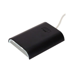 A black HID ICLASS SE CP1000 encoder with a USB cable attached to it.