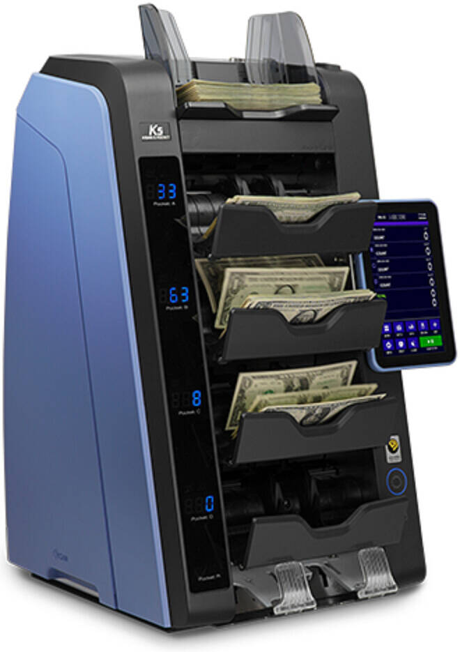 Money counting machine with multiple slots for currency, displaying digital readouts on a white background.
