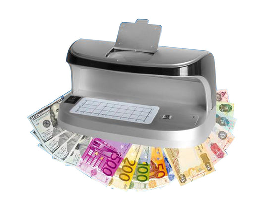 A gray Nigachi money detector with UV/MG/WM/MGF detection capabilities, surrounded by various counterfeit bills.