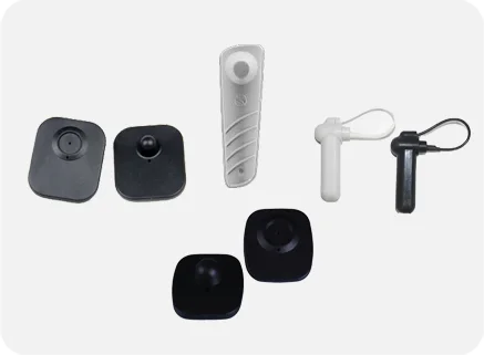 Set of electronic devices including a remote control and various sensors on a white background