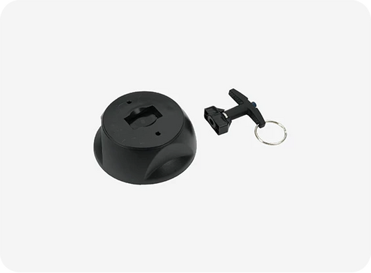 Black camera lens cap and tripod mount on a white background