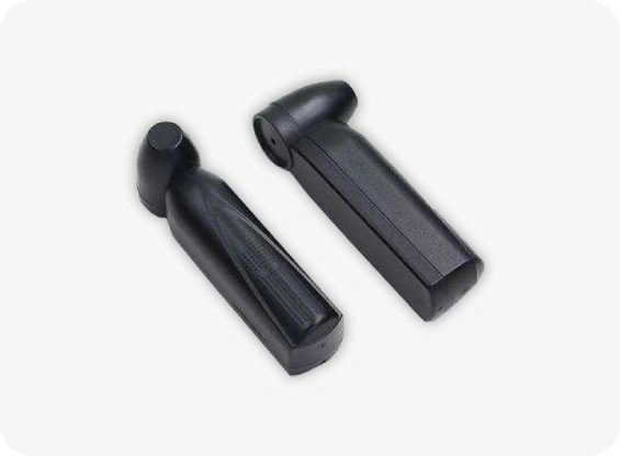 Two black plastic components on a white background