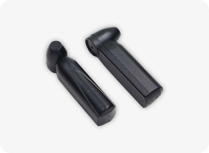Two black plastic components on a white background