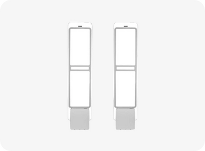 Pair of white earrings on a light gray background