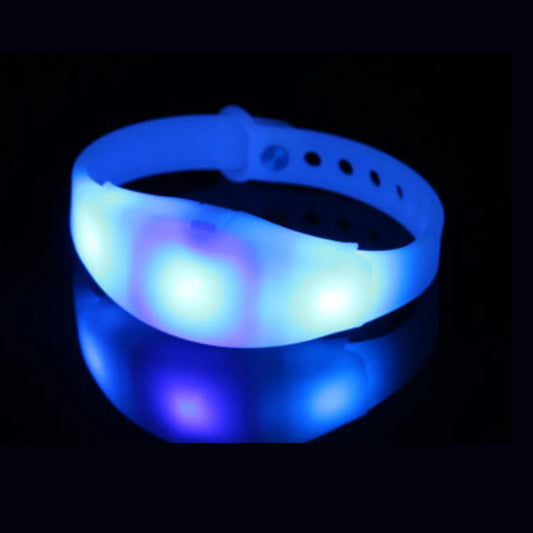 LED wristband glowing with multicolor lights on a black background
