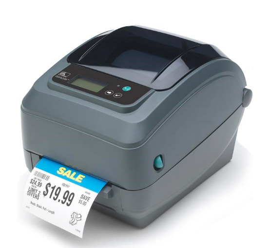 A Zebra GX420d barcode label printer in gray color, with a label partially dispensed from the printer.