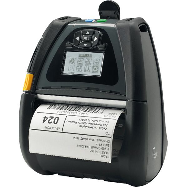 A portable Zebra barcode printer with a label rolling out of it, indicating active printing.