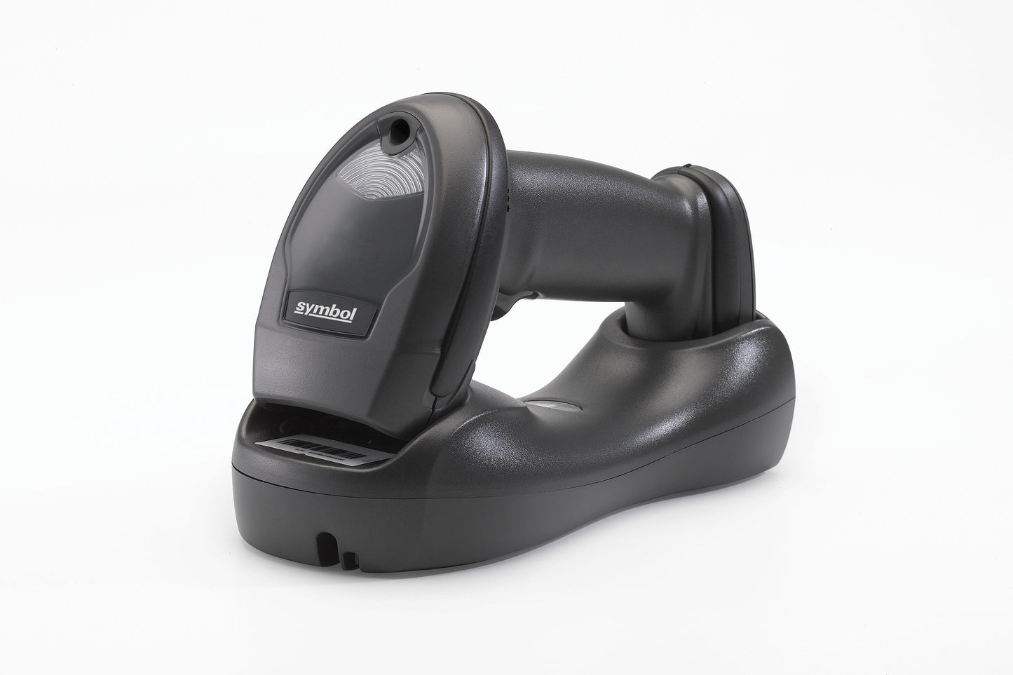 A black cordless linear imager barcode scanner with Bluetooth connectivity, resting on its charging cradle.