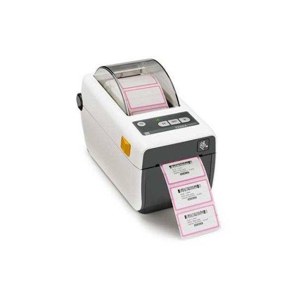 A Zebra ZD410 barcode label printer with labels coming out of the slot, showcasing its active printing function.