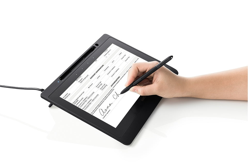 Person using a digital tablet with stylus on a white background