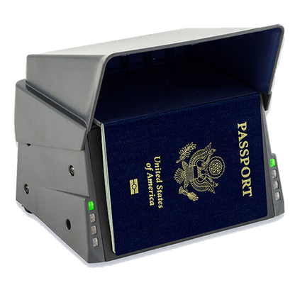 Passport scanner with a U.S. passport inserted on a white background